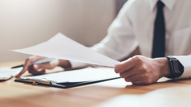 businessman working his office with documents check accuracy information 2034 1118