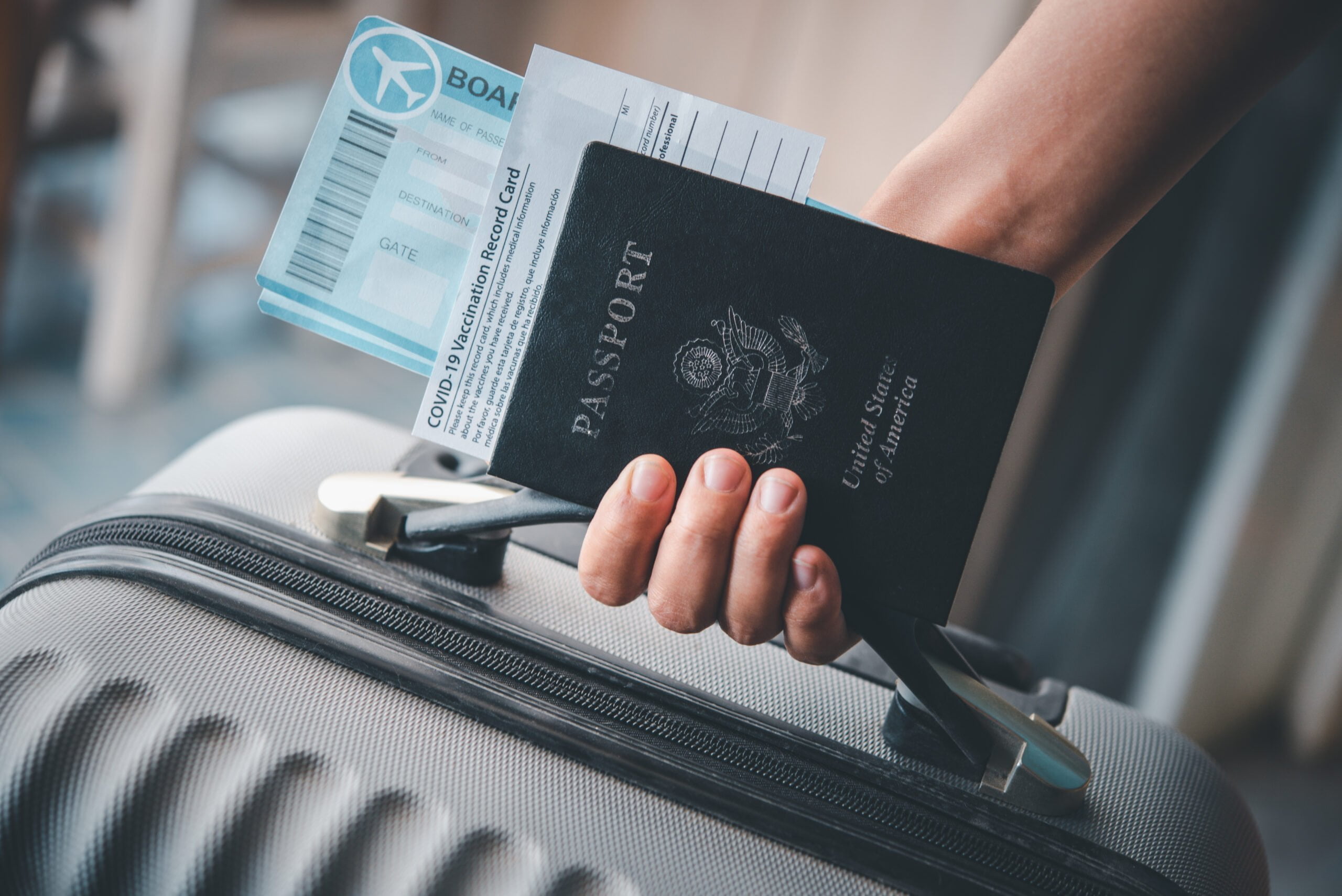 พาสปอร์ต หนังสือเดินทาง people holding passports coronavirus vaccination card map travel with luggage trip covid 19 around world scaled พาสปอร์ต วีซ่า