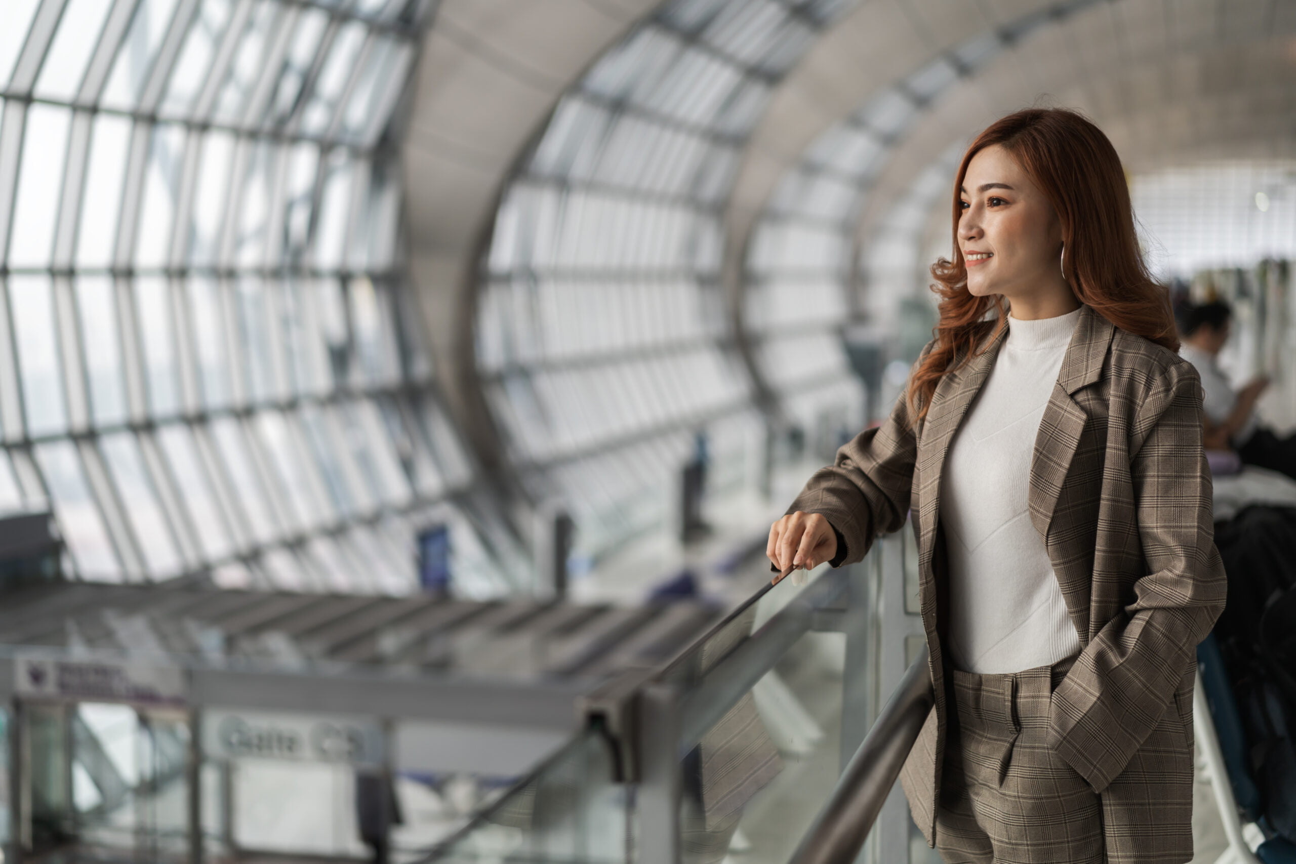 woman waiting flight airport scaled