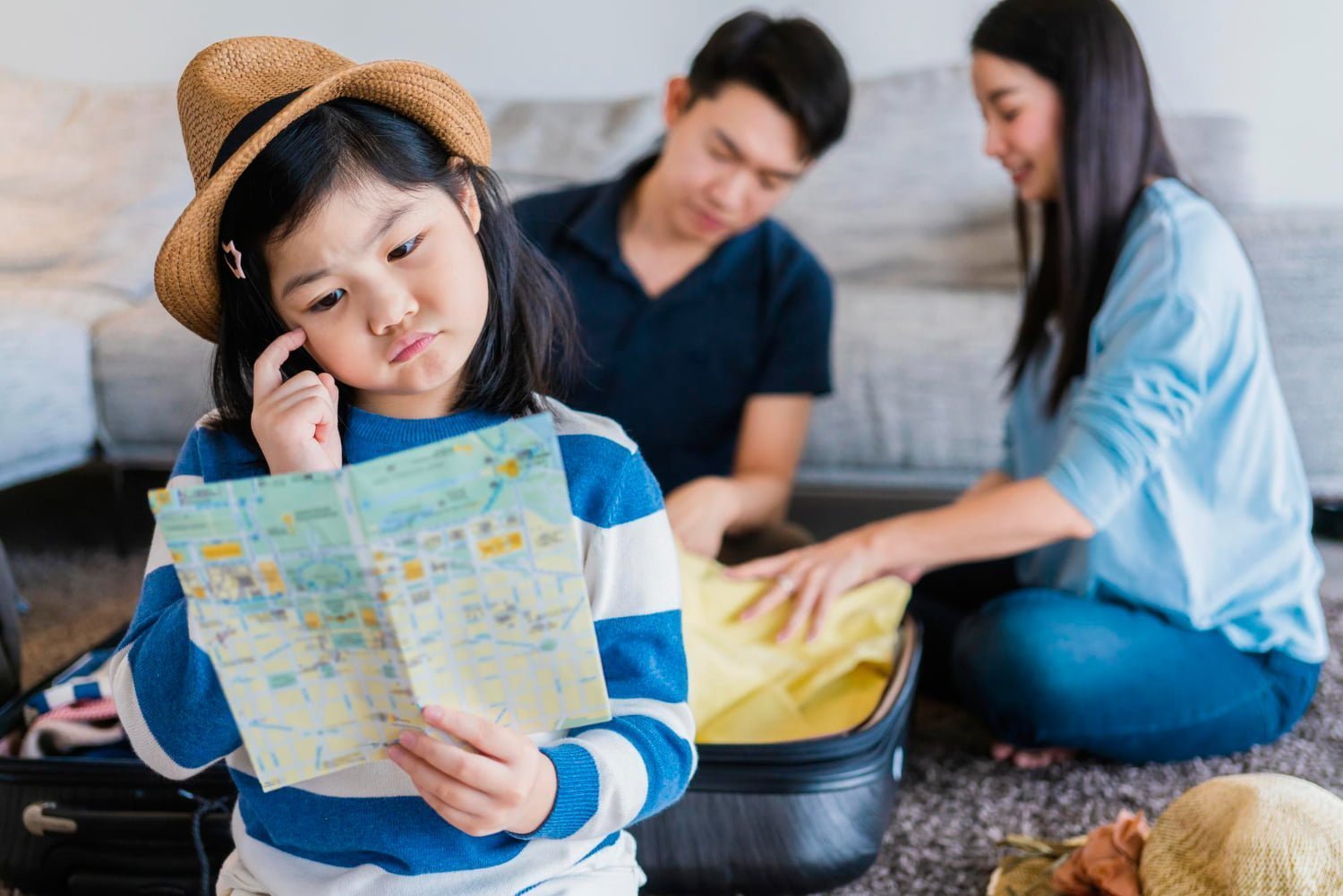 asian girl kid with map planing trip with family